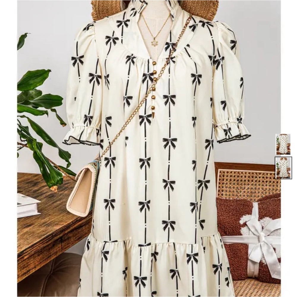 Elegant Cream and Black Bow Dress